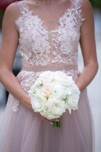 Maid of Honor in Pinkish Nude Modern Romantic Flowy Floral Lace and Tulle Dress Holding Round Ivory White and Blush Pink Rose Floral Bouquet | Tampa Bay Wedding Photographer Carrie Wildes Photography | Bella Bridesmaids