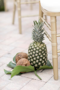 Tropical Elegant Wedding Ceremony Decor, Coconuts and Pineapples on Monstera Palm Leaf | Tampa Bay Wedding Photographer Lifelong Photography Studios