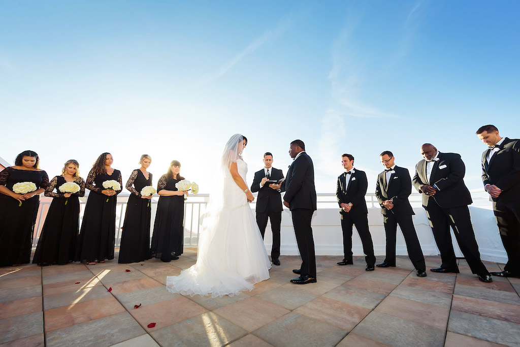 Tampa Bay Bride and Groom Exchange Vows at Rooftop Waterfront Wedding Ceremony | Florida Historic Pink Palace Hotel The Don CeSar in St. Pete Beach