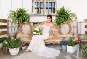 Classic Florida Bride Beauty Wedding Portrait on Vintage Gold and Cream Couch in Wtoo Watters Lace Fitted Off the Shoulder Wedding Dress Holding Organic Greenery and White, Ivory Floral Bouquet | Tampa Bay Wedding Florist Bruce Wayne Florals