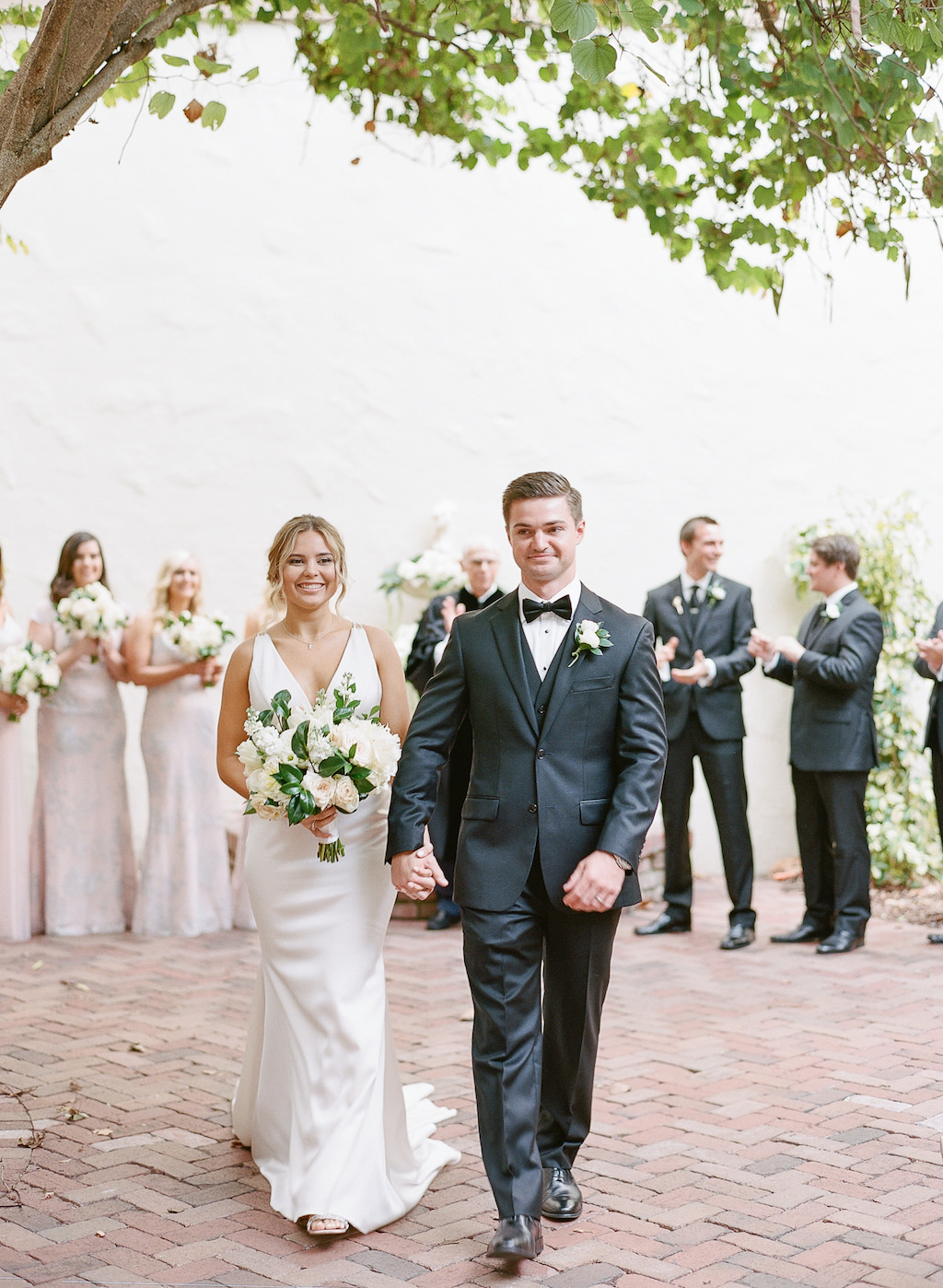 Tampa Bay Bride and Groom Wedding Exit Portrait, Bride Holding Garden Inspired Classic White, Ivory, Blush Pink and Greenery Floral Bouquet