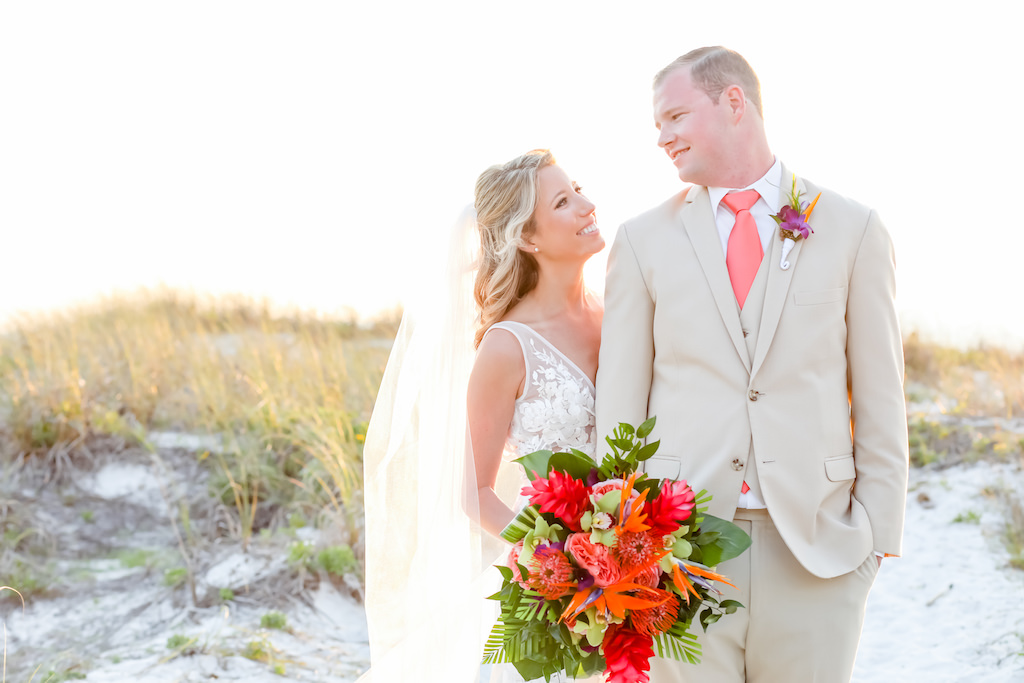 Florida Bride and Groom St. Pete Beach Wedding Portrait, Tropical, Island Inspired Colorful Floral Bouquet, Bright Pink, Orange, Coral, Green, Purple Exotic Flowers | Tampa Bay Wedding Photographer Lifelong Photography Studios | Tampa Bay Wedding Hair and Makeup Artist Michele Renee The Studio