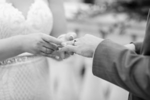 Bride and Groom Exchanging Wedding Rings During Ceremony | Tampa Bay Wedding Photographer Lifelong Photography Studios