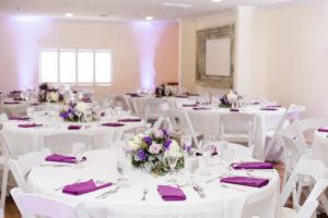 Minimalist, Garden-Inspired Wedding Decor and Reception, Round Tables with Low Floral Centerpieces with Ivory, Pink, White and Purple Flowers, Silver Accents | Tampa Bay Waterfront Wedding Venue Beso Del Sol