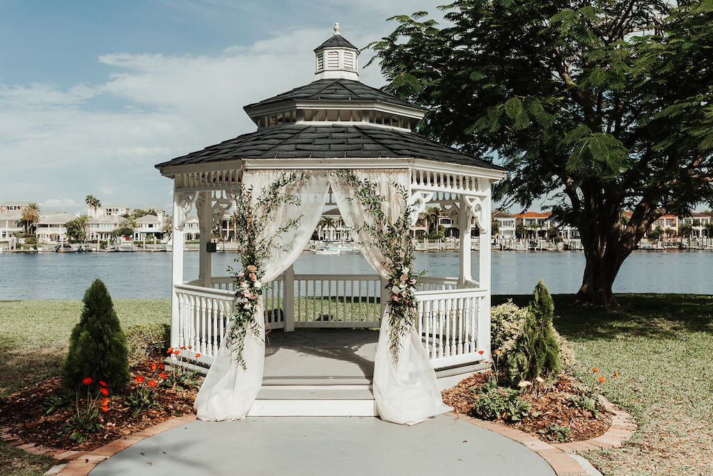 Garden Chic Waterfront Wedding Ceremony Decor, White Draped Gazebo with White, Pink Florals and Greenery Arrangements | Tampa Bay Waterfront Wedding Venue Davis Islands Garden Club