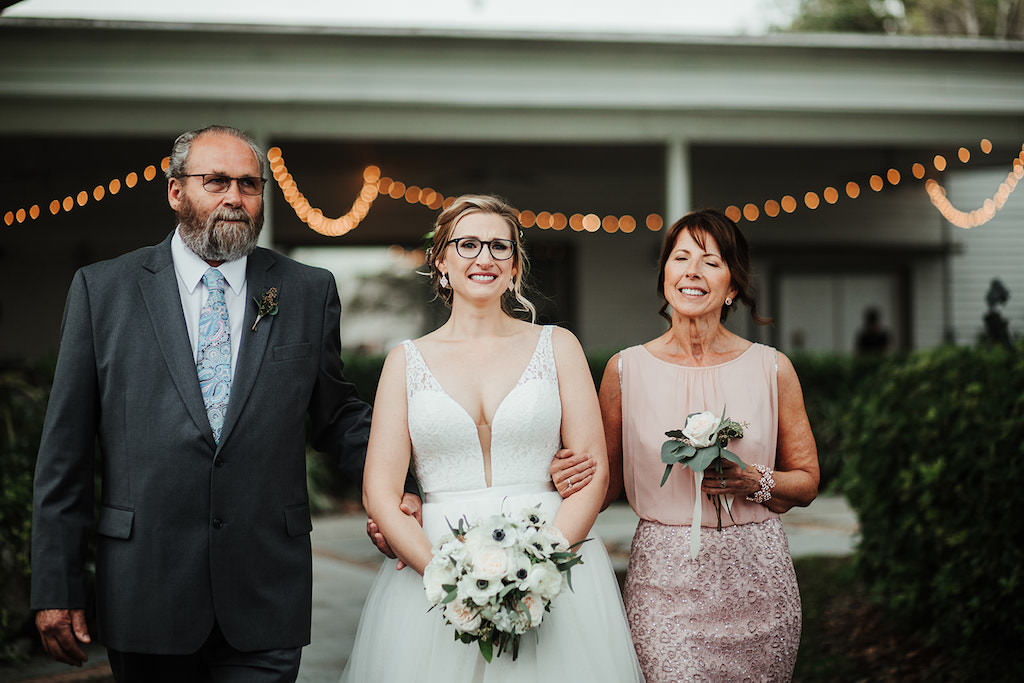 Florida Bride with Mother and Father Walking Down the Wedding Ceremony Aisle Processional | Tampa Bay Wedding Hair and Makeup Artist Femme Akoi
