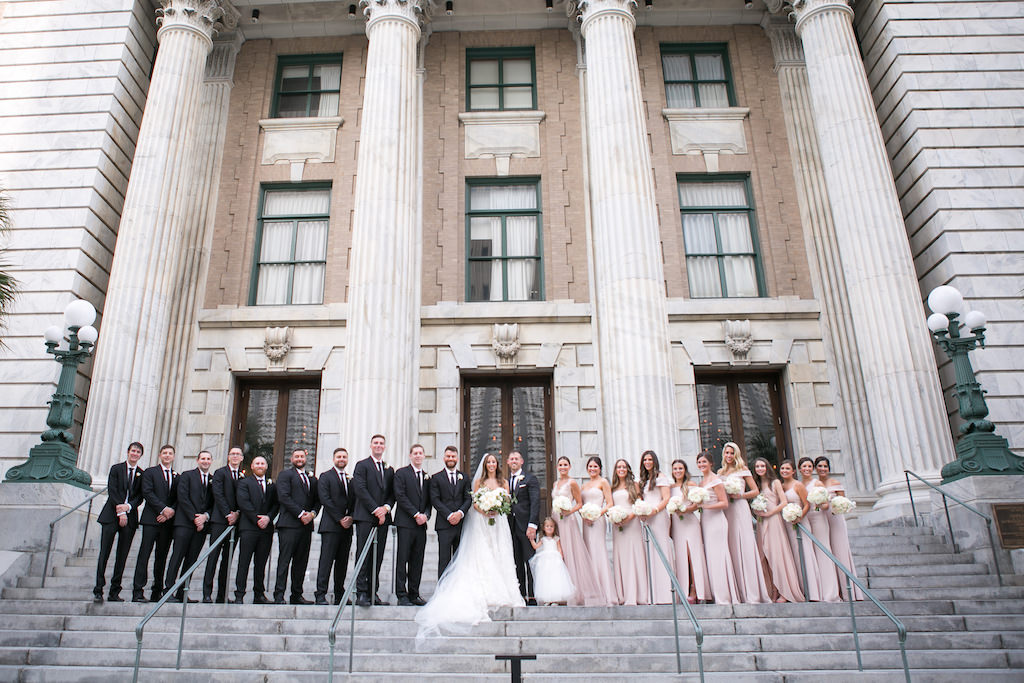 Florida Bride, Groom, Bridesmaids and Groomsmen Bridal Party Portrait on Steps of Downtown Tampa Hotel Venue Le Meridien |Tampa Bay Wedding Photographer Carrie Wildes Photography | Bridesmaids Dress Shop Bella Bridesmaids | Tampa Dress Shop Isabel O'Neil Bridal Collection