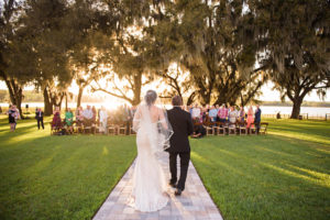 Florida Bride and Father Walking Down the Wedding Ceremony Aisle Processional Outdoor Sunset Photo