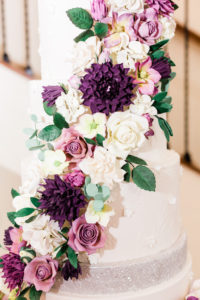 Elegant, White Wedding Cake with Lush Edible Sugar Floral Accents, White, Purple, Pink, Ivory Flowers with Silver Accents | Modern Tampa Bay Waterfront Wedding Venue Beso Del Sol