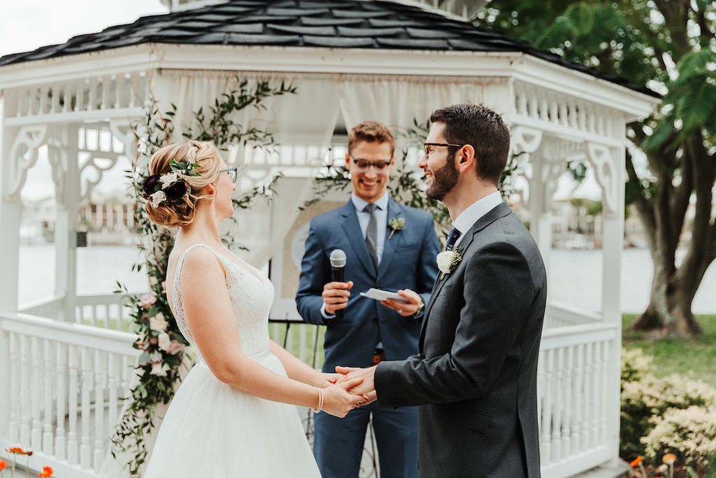 Florida Bride and Groom Exchanging Vows Waterfront Outdoor Wedding Ceremony Portrait | Tampa Bay Wedding Venue Davis Islands Garden Club