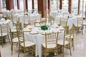 Modern Classic Tropical Wedding Reception Decor, Round Tables with White Linens, Gold Chiavari Chairs, Gold Chargers, Monstera Palm Tree Leaf Centerpiece | Wedding Photographer Kera Photography | St. Pete Wedding Venue The Poynter Institute