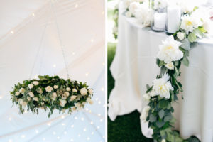 Elegant, Simple, Classic Garden Inspired Wedding Tent Reception Decor, Hanging Greenery and Ivory Floral Wreath, White Linen Table with Greenery Garland and White Flowers | Tampa Bay Wedding Rentals Gabro Event Services