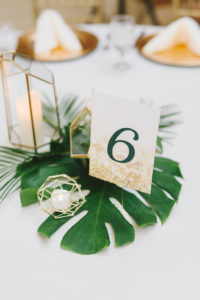 Modern Tropical Classic Wedding Reception Decor, Monstera Palm Tree Leaf Centerpiece with Geometric Candle Holders, White and Gold Cardstock Table Number | Wedding Photographer Kera Photography