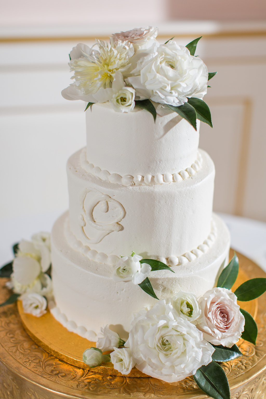 Classic White Three Tier Round Wedding Cake with Monogram and Garnished with Real White and Blush Pink Flowers
