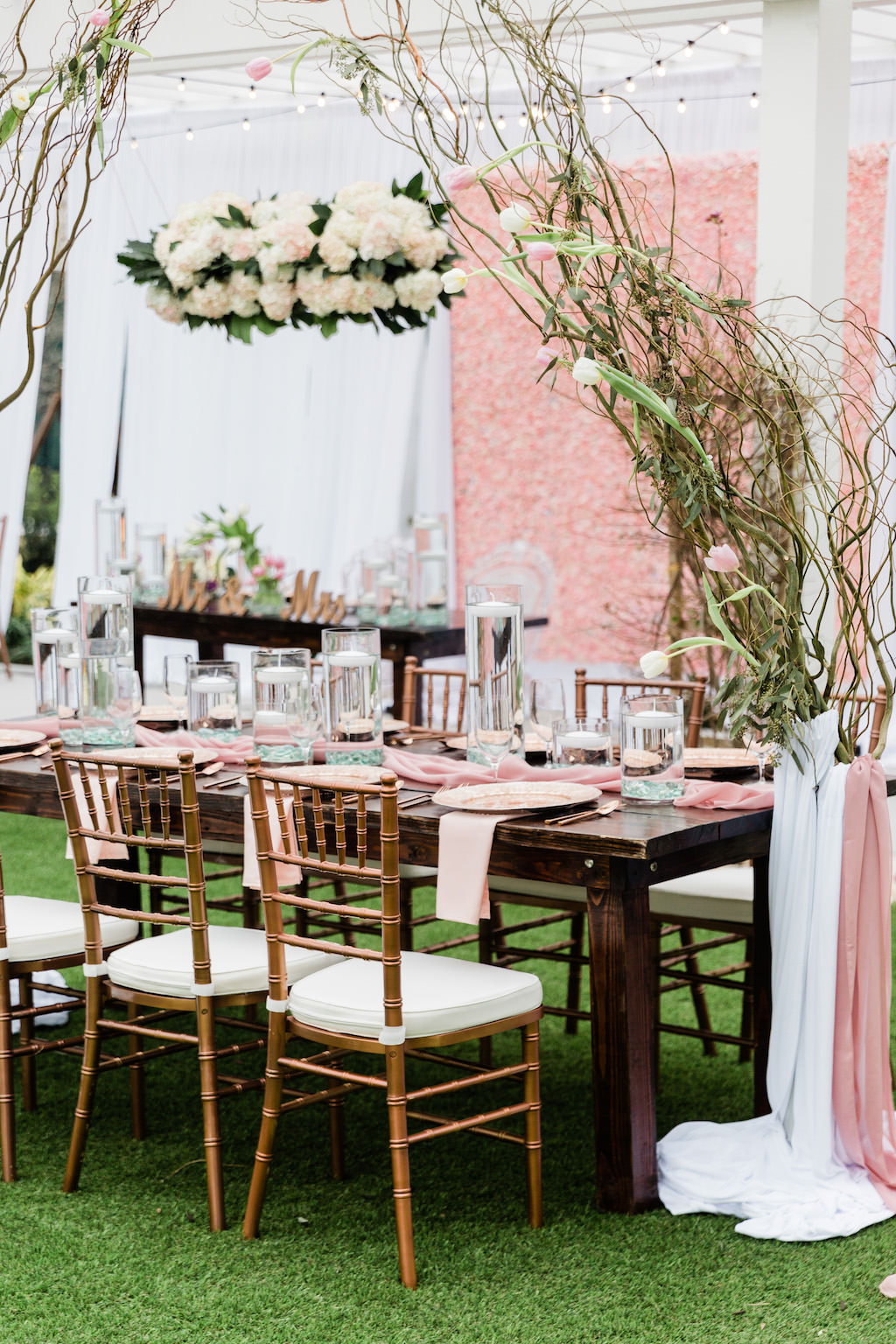 Whimsical Garden Wedding Decor and Reception under Gazebo, Pink Floral Boxwood Wall, White Draping, Hanging Floral Arrangement, Long Feasting Tables. Rose Gold Chiavari Chairs, Floral Curly Willow Arches, | Tampa Bay Wedding Planner Special Moments Event Planning | Tampa Bay Wedding Florist Gabro Event Services | Tampa Bay Wedding Rentals A Chair Affair