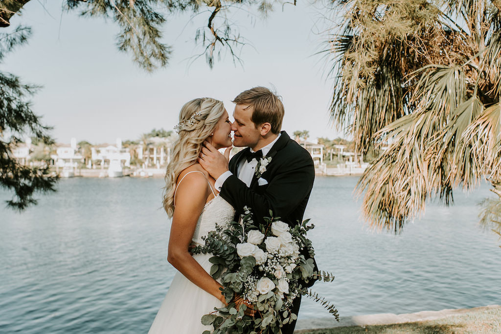 Romantic Waterfront Bride and Groom Intimate Wedding Portrait, Bride with Organic Greenery and White, Ivory Floral Bouquet | Tampa Bay Wedding Hair and Makeup Femme Akoi