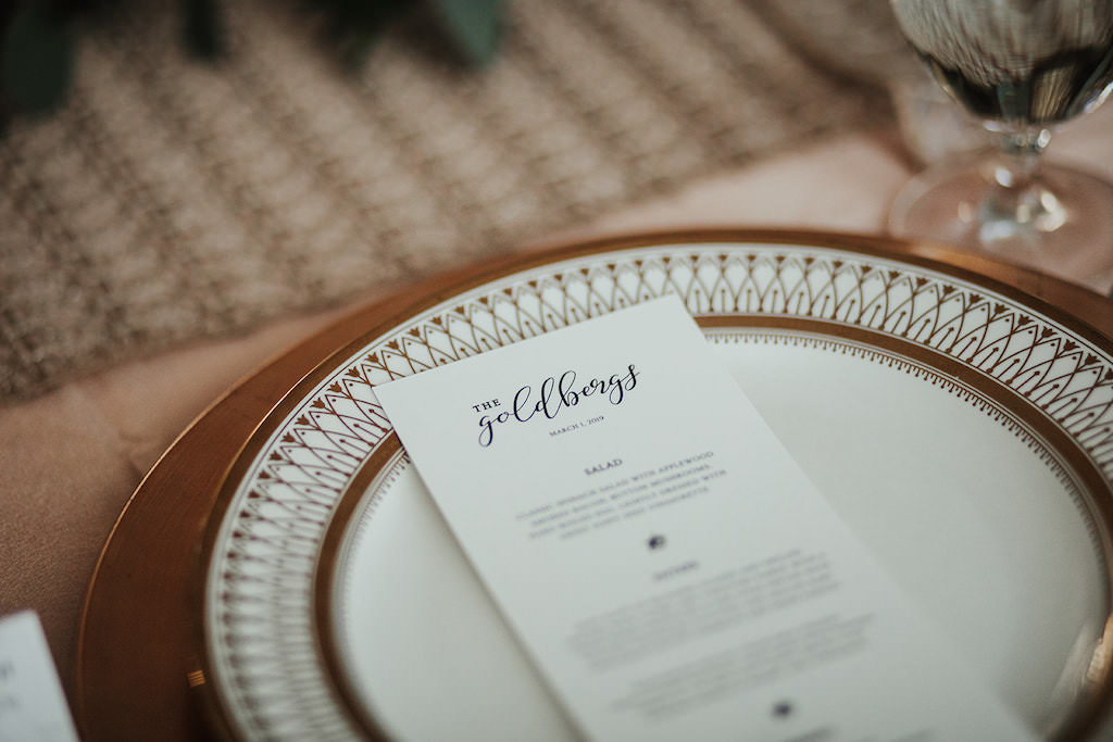 Custom White and Black Wedding Stationery Menu on Elegant Gold China Dinnerware and Gold Charger