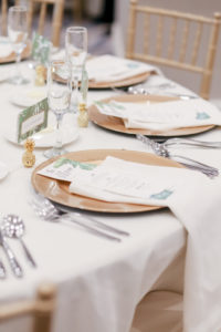 Tropical Elegance Wedding Reception Decor, White Linens, Gold Chargers, Tropical Stationery and Mini Gold Pineapple Accessory, Gold Chiavari Chairs | Tampa Bay Wedding Photographer Lifelong Photography Studios