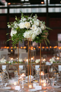 Modern Rustic Tuscan Inspired Wedding Reception Decor, Tall Gold Stand with White, Ivory and Greenery Floral Centerpiece | Tampa Bay Wedding Photographer Carrie Wildes Photography