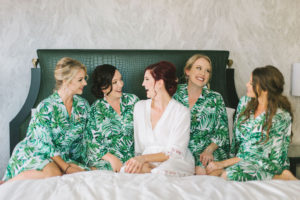 Florida Bride and Bridesmaids Getting Ready Hotel Suite Wedding Photo in Tropical Palm Tree Leaf Robes | Wedding Photographer Kera Photography | Tampa Bay Wedding Hair and Makeup Group Destiny and Light Hair and Makeup Group
