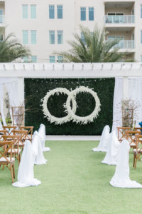 Modern, Garden Inspired Outdoor Wedding Ceremony, Gazebo Alter, Luxurious Infinity Ring Hanging Floral Arrangement with White Orchids, Dark Green Boxwood Wall, Wood Cross Back Chairs, Draping | Tampa Bay Wedding Planner Special Moments Event Planning | Tampa Bay Wedding Florist Gabro Event Services