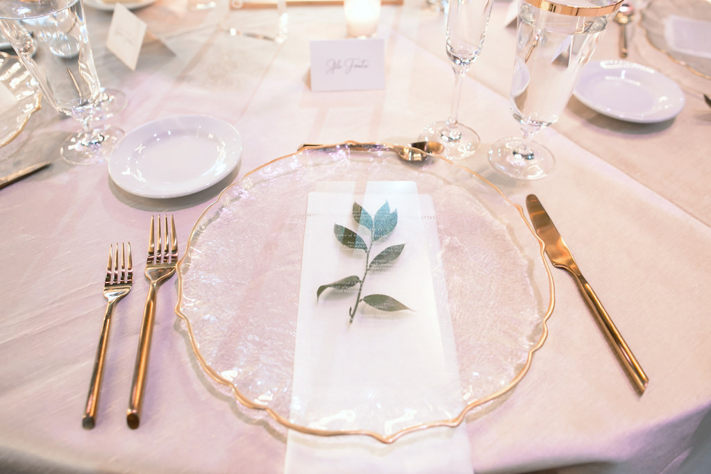Modern Elegant Tuscan Inspired Wedding Reception Decor, Clear Glass and Gold Rimmed Chargers, Gold Silverware, Floral Tablecloth and Monogram White Linens | Tampa Bay Wedding Photographer Carrie Wildes Photography | Tampa Bay Wedding and Events Rentals by Kate Ryan Event Rentals