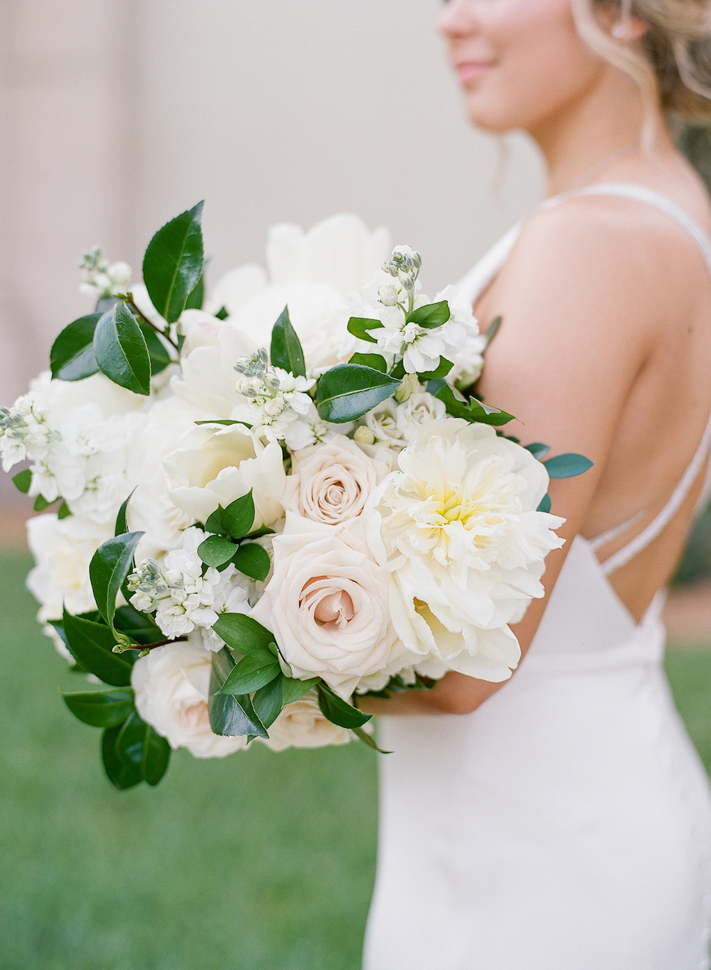 Tampa Bay Bride Holding Classic White, Blush Pink Roses and Greenery Floral Bouquet