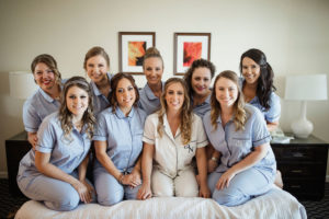 Classic Florida Bride and Bridesmaids in Matching Light Blue Custom Monogram Pajamas Getting Ready Hotel Wedding Portrait | Tampa Bay Wedding Hair and Makeup LDM Beauty Group