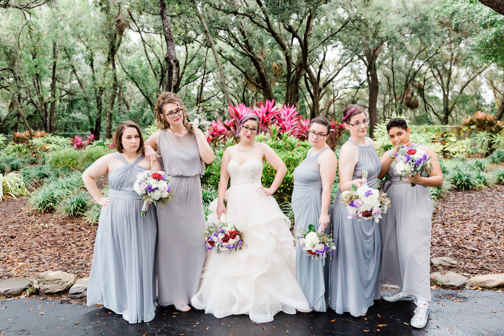 Modern, Colorful Florida Bride and Bridesmaids in Clearwater Park, Purple and Grey Ombre Mix and Match Long Bridesmaid Dresses, Holding Whimsical Floral Bouquet Purple, Ivory, White, Red, Flowers with Greenery