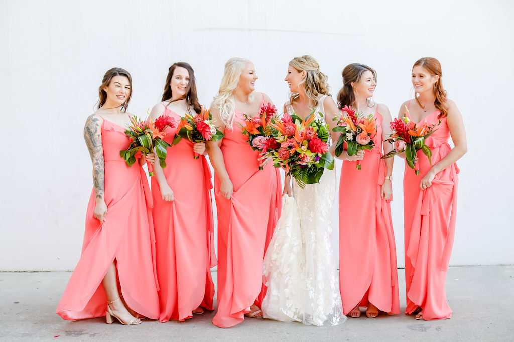 Elegant Florida Bride and Bridesmaids, Carrying Vibrant, Tropical Floral Bouquet, Colorful Island Inspired Flowers, Coral Pink Long Bridesmaid Dresses | Tampa Bay Wedding Photographer Lifelong Photography Studios | Tampa Bay Wedding Hair and Makeup Artist Michele Renee The Studio | South Tampa Wedding and Bridal Party Dress Shop Bella Bridesmaids