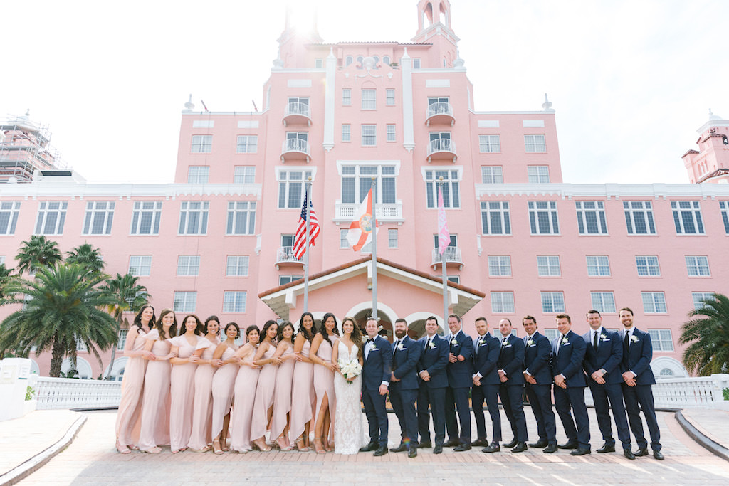 Modern Tropical Bride, Groom, Groomsmen and Bridesmaids in Mix and Match Blush Pink Dresses Wedding Party Portrait | Waterfront Historic St. Pete Beach Wedding Venue The Don Cesar | St. Pete Wedding Planner Parties A'La Carte