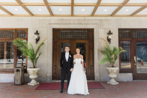Classic Florida Bride and Groom First Look outside Hotel Floridan, Black-Tie Formal Tuxedo by Suit Supply, White Wtoo by Watters Wedding Dress, Mimi