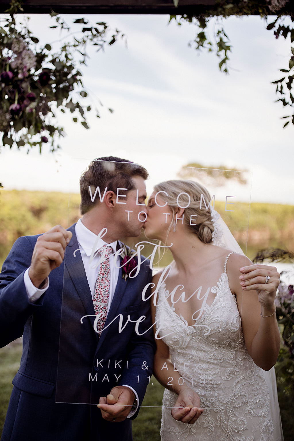 INSTAGRAM Unique Bride and Groom Intimate Kissing Wedding Portrait Behind Clear Acrylic Custom Welcome Sign