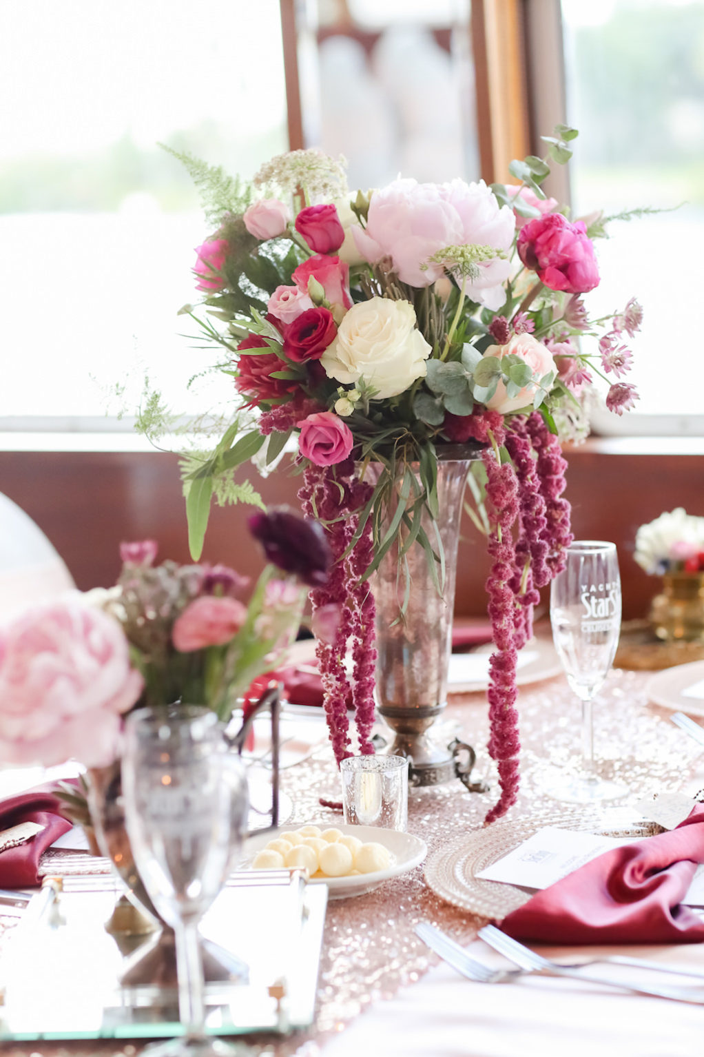 French Country Colorful Inspired Wedding Reception Decor, Blush Pink, Pink, Ivory and Greenery Floral Centerpiece and Pink Hanging Amaranthus in Glass Vase and Sparkle Blush Pink Linens | Tampa Bay Wedding Photographer Lifelong Photography Studio | Wedding Rentals Kate Ryan Event Rentals