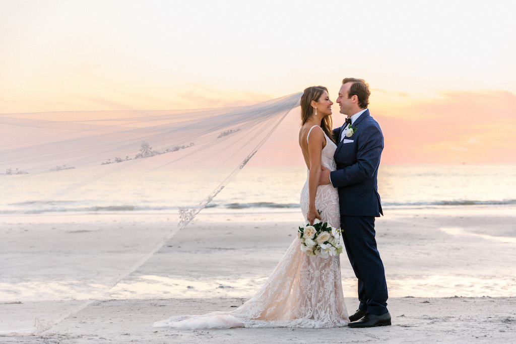 Romantic St. Pete Beach Bride and Groom Sunset Creative Veil Blowing in the Wind Wedding Portrait | Galia Lahav Wedding Dress