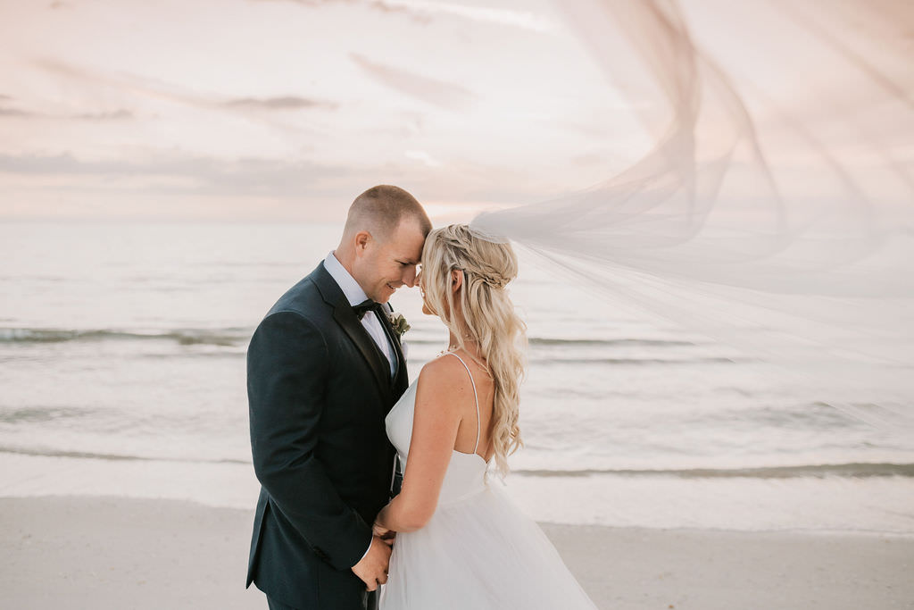 Florida Bride and Groom Sunset Beach Wedding Portrait | Atoo Ballgown Bridal Wedding Dress Portrait on Clearwater Beach