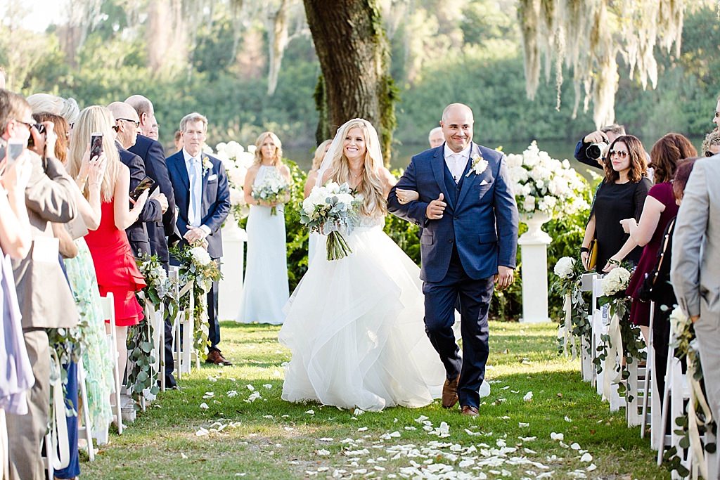 Tampa Bay Bride and Groom Exiting Wedding Ceremony Recessional Wedding Portrait | Palm Harbor Wedding Venue Innisbrook Golf and Spa Resort | Tampa Bay Wedding Hair and Makeup Femme Akoi Beauty Studio