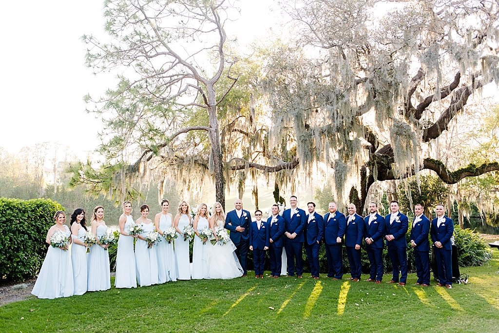 Florida Wedding Party Wedding Portrait, Bridesmaids in Ice Blue Floor Length Dresses, Groomsmen in Navy Blue Suits | Palm Harbor Wedding Venue Innisbrook Golf and Spa Resort | Tampa Bay Wedding Hair and Makeup Femme Akoi Beauty Studio | South Tampa Wedding and Bridal Shop Bella Bridesmaids