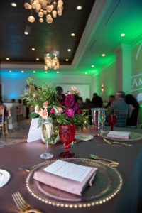 Tampa Classic Elegant Wedding Reception Decor, Clear Glass and Gold Bead Rimmed Charger Plates, Blush Pink Linen, Blush Pink, Purple, and Greenery Floral Centerpiece, Green Uplighting | Custom Tampa Wedding Uplighting by Gabro Event Services