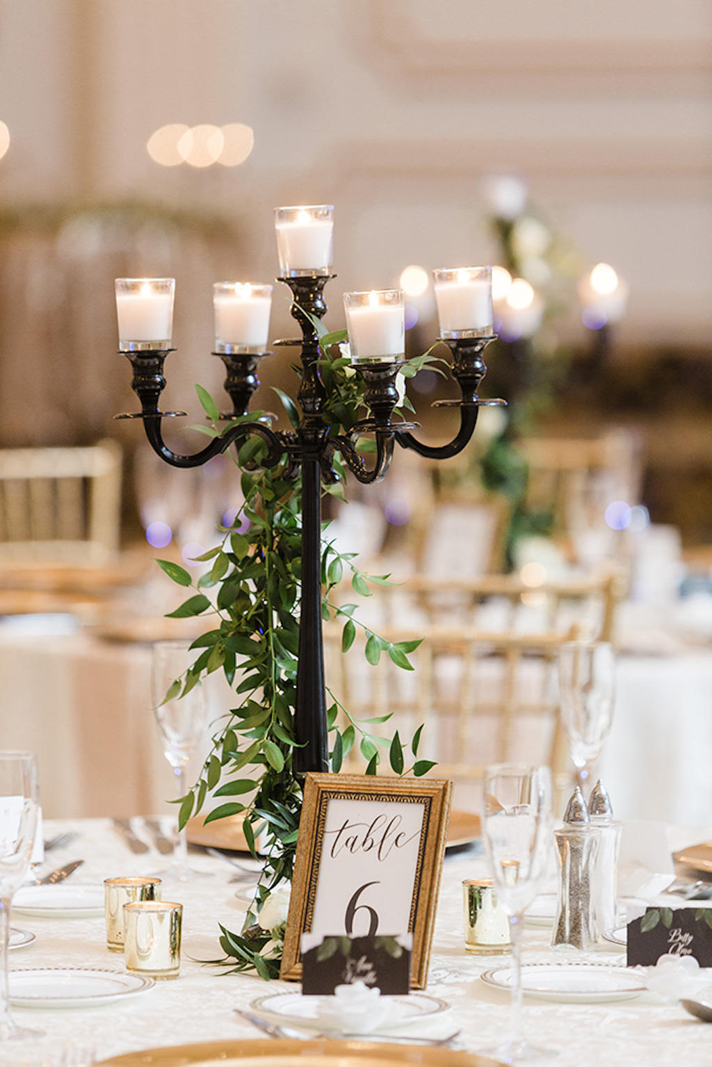 Elegant, Classic Wedding Decor, Tall Black Candelabra with Greenery, Gold Accents | Tampa Bay Wedding Planner Coastal Coordinating
