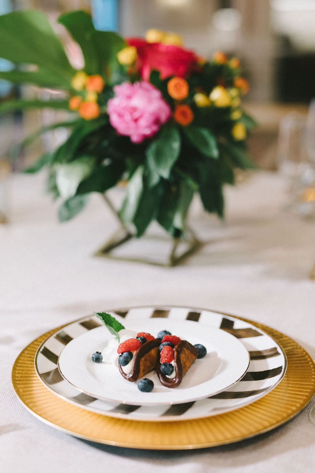 Wedding Dessert Mini Chocolate Tacos with Berries on Gold and White Plate and Gold Charger | Tampa Bay Wedding Photographer Kera Photography | Wedding Linens and Tabletop Rentals Kate Ryan Event Rentals | Downtown St. Petersburg Wedding Caterer Red Mesa Events