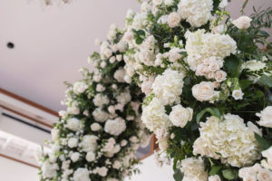 Elegant, Classic White Hydrangeas, Blush Pink, and White Flowers and Greenery Arch Wedding Ceremony Decor | Tampa Bay Wedding Photographer Kristen Marie Photography | Clearwater Beach Wedding Florist Gabro Event Services