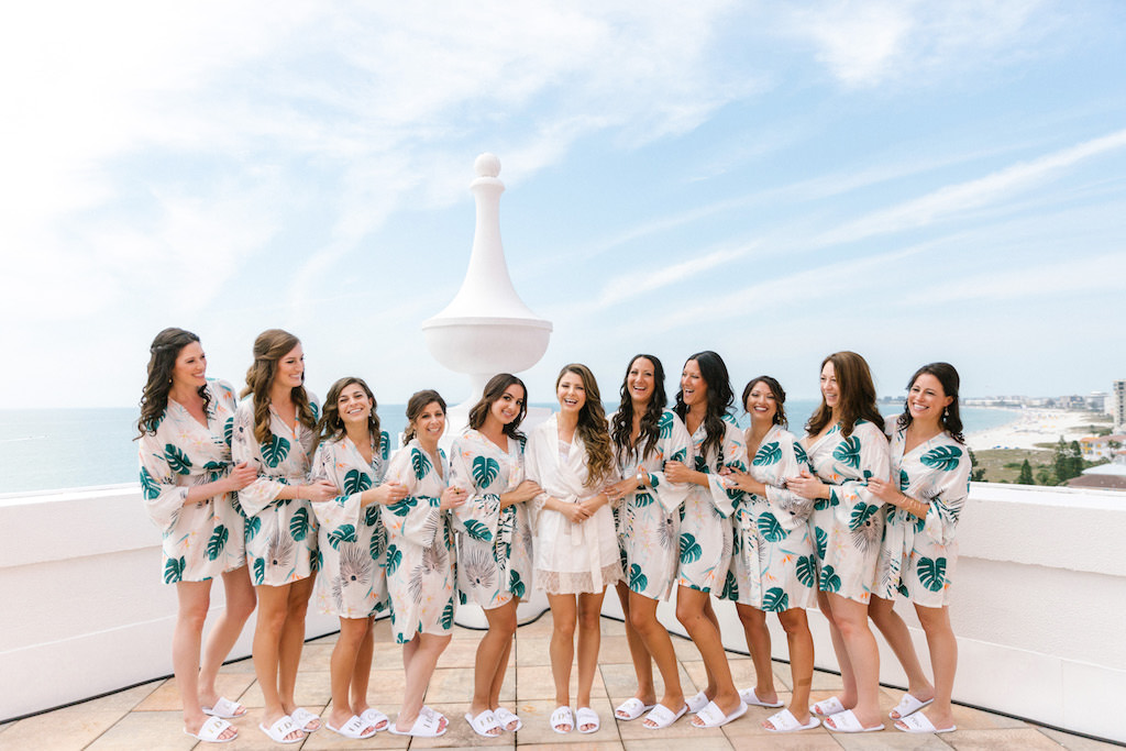 Florida Bride Getting Ready Wedding Rooftop Portrait with Bridesmaids in Tropical Palm Leaf Robes | Waterfront St. Petersburg Wedding Venue The Don Cesar