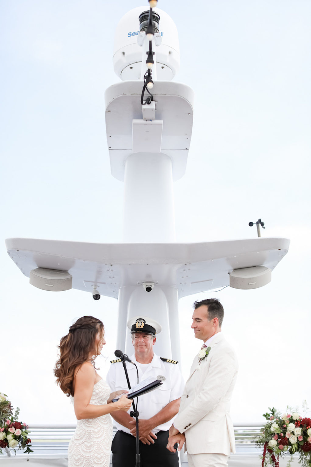 Florida Bride and Groom Exchanging Vows During Wedding Ceremony Portrait | Tampa Bay Wedding Photographer Lifelong Photography Studio | Clearwater Beach Waterfront Wedding Venue Yacht Starship