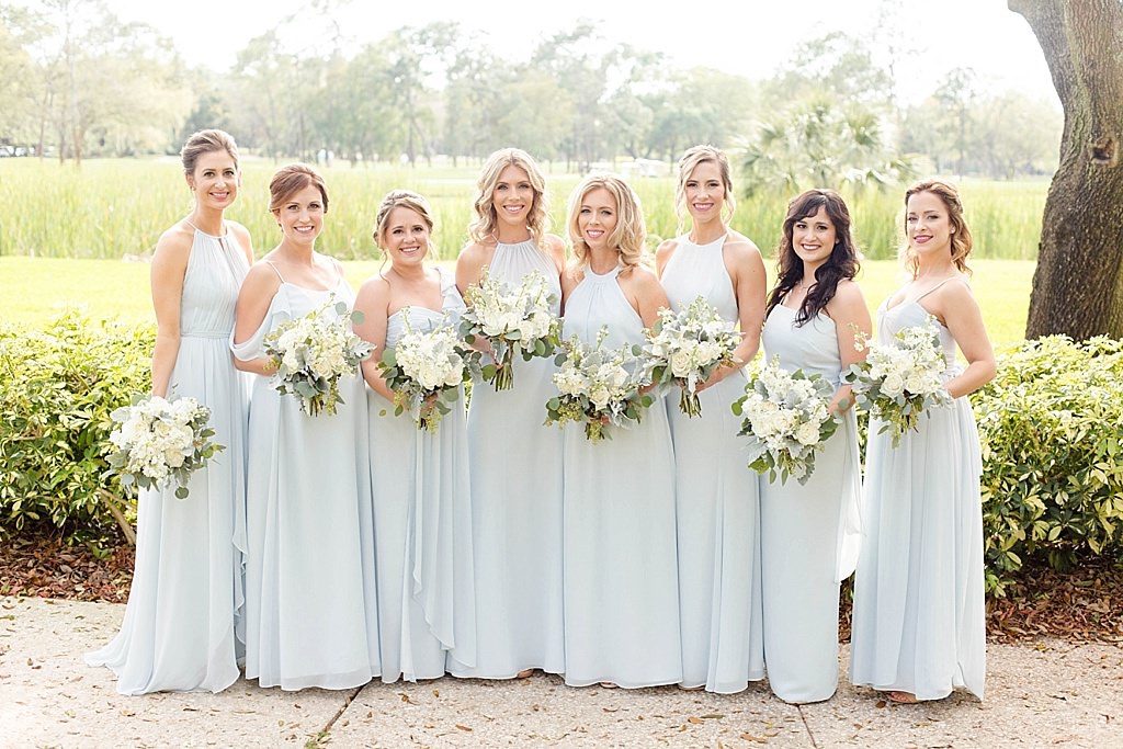 Florida Bridal Party Wedding Portrait, Bridesmaids in Mix and Match Ice Blue Floor Length Long Dresses with Ivory, White, Dusty Miller and Greenery Floral Bouquets | South Tampa Wedding and Bridal Dress Shop Bella Bridesmaids