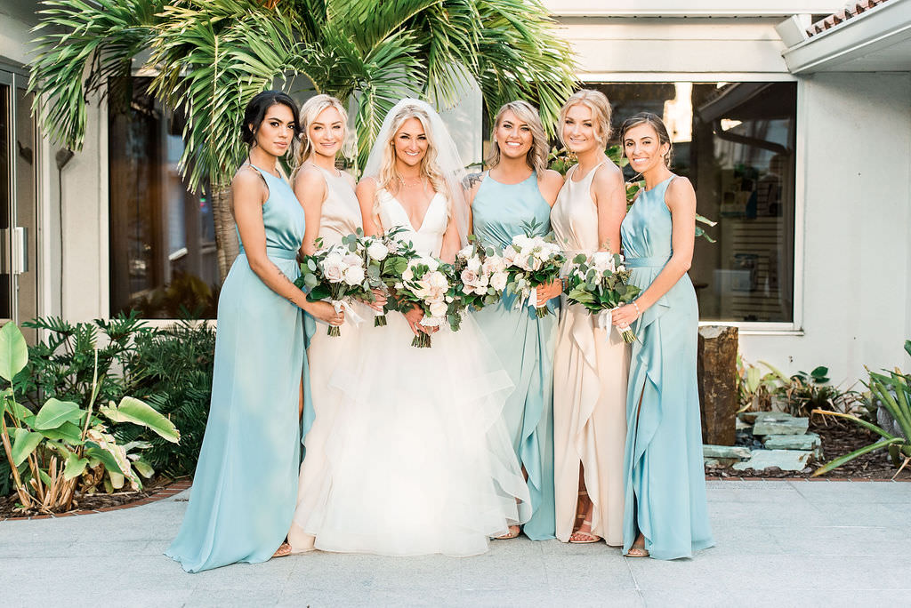 Bride and Bridesmaids in Atoo Bridal Wedding Dress with Champagne Blush and Light Blue Vera Wang by David's Bridal Bridesmaids Wedding Dress Outdoor Portrait