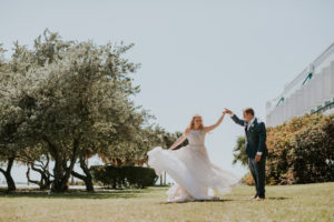 Fun St. Pete Bride and Groom Dancing Outside Wedding Portrait | Tampa Wedding Venue Station House