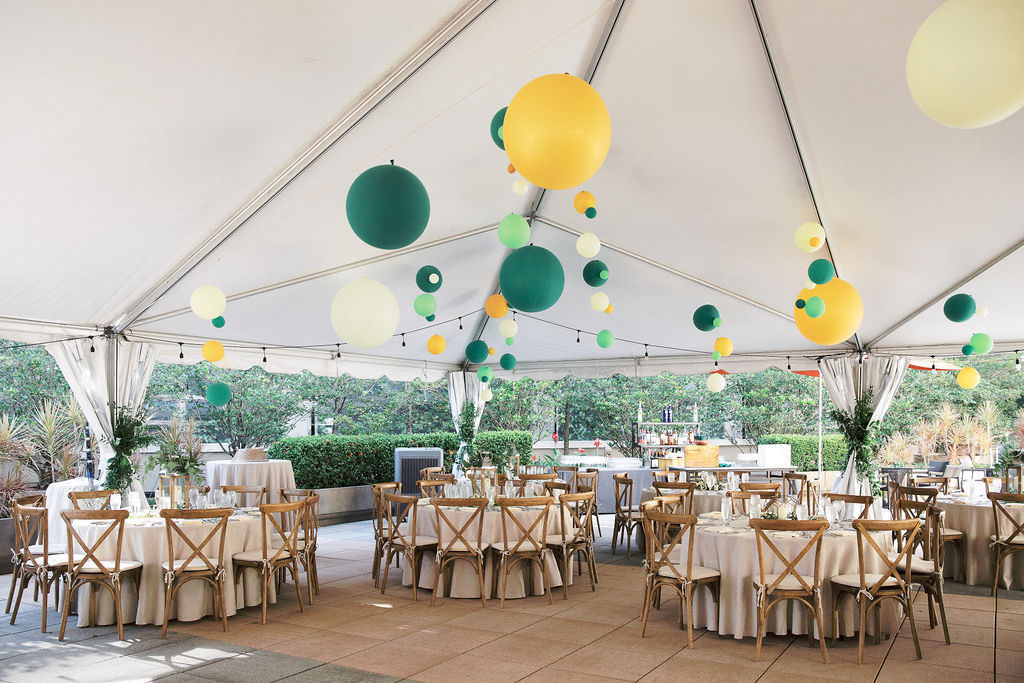 Whimsical Rustic Elegant Tent Wedding Reception Decor, Round Tables with Ivory Linens, Wooden Crossback Chairs, Green, Yellow and White Hanging Balloons | Tampa Bay Wedding Venue The Epicurean Hotel