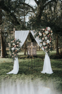Rustic Chic Outdoor Wedding Ceremony Decor, Arch with White Linen Draping and White Hydrangeas, Blush Pink Roses and Greenery Floral Arrangement | Tampa Wedding Venue Rafter J Ranch | Wedding Planner Kelly Kennedy Weddings and Events
