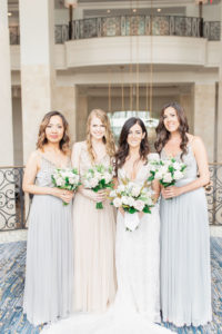 Classic Bride and Bridesmaids in Mix and Match BHLDN Gray and Nude Floor Length Flowy Dresses with Organic Ivory Roses and Greenery Floral Bouquets | Tampa Bay Wedding Hair and Makeup Femme Akoi Beauty Studio